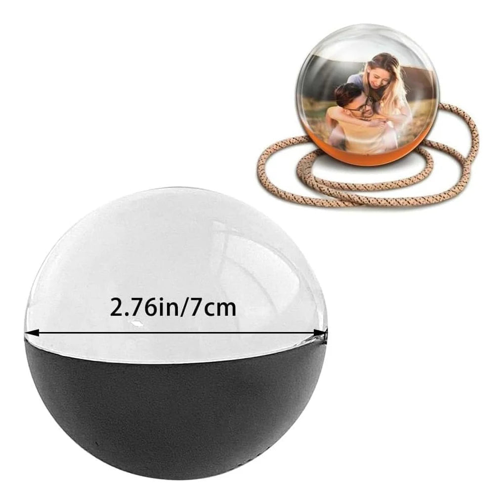 Black spherical photo frame with a measurement label and inset showing a photo inside.