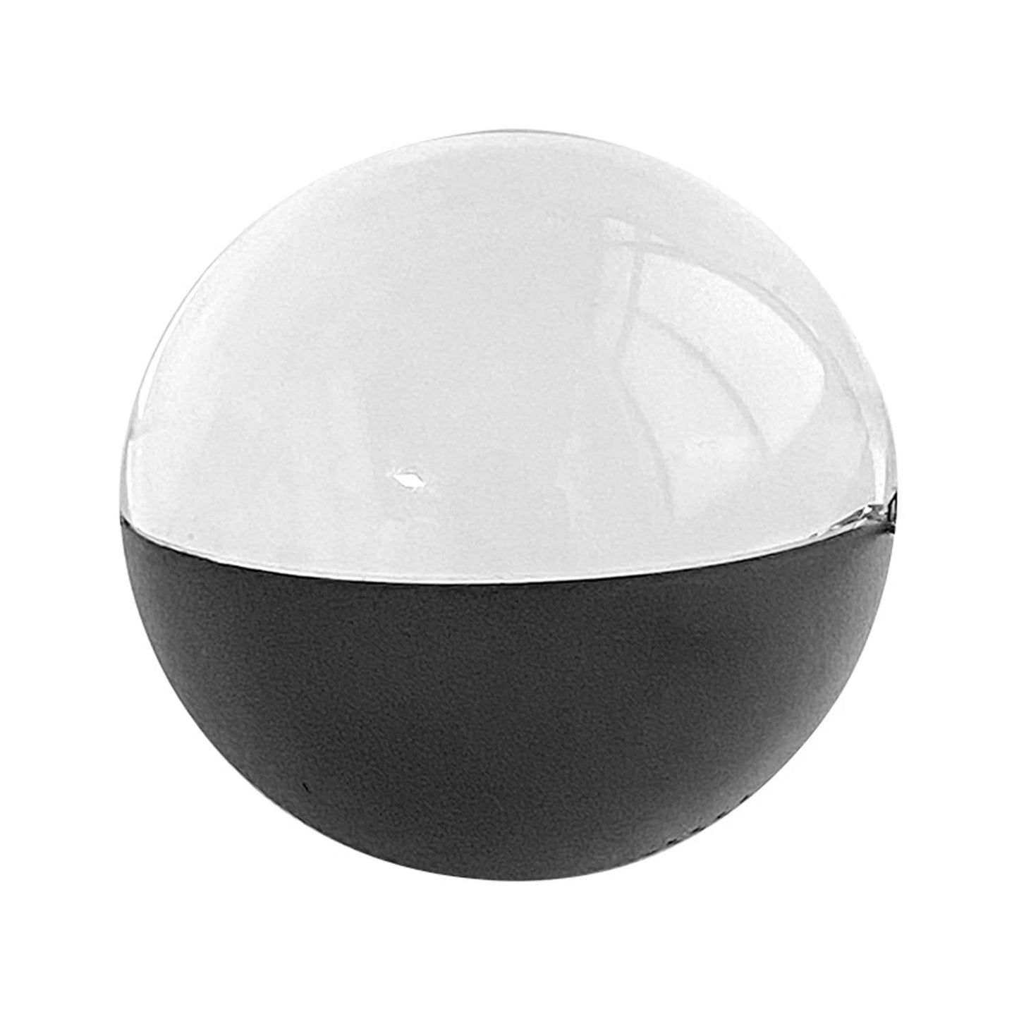 Spherical object with black base and clear top on a white background